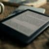 black tablet computer on brown wooden table