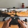 person holding black game controller