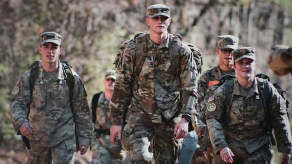 men in camouflage uniform standing on field during daytime