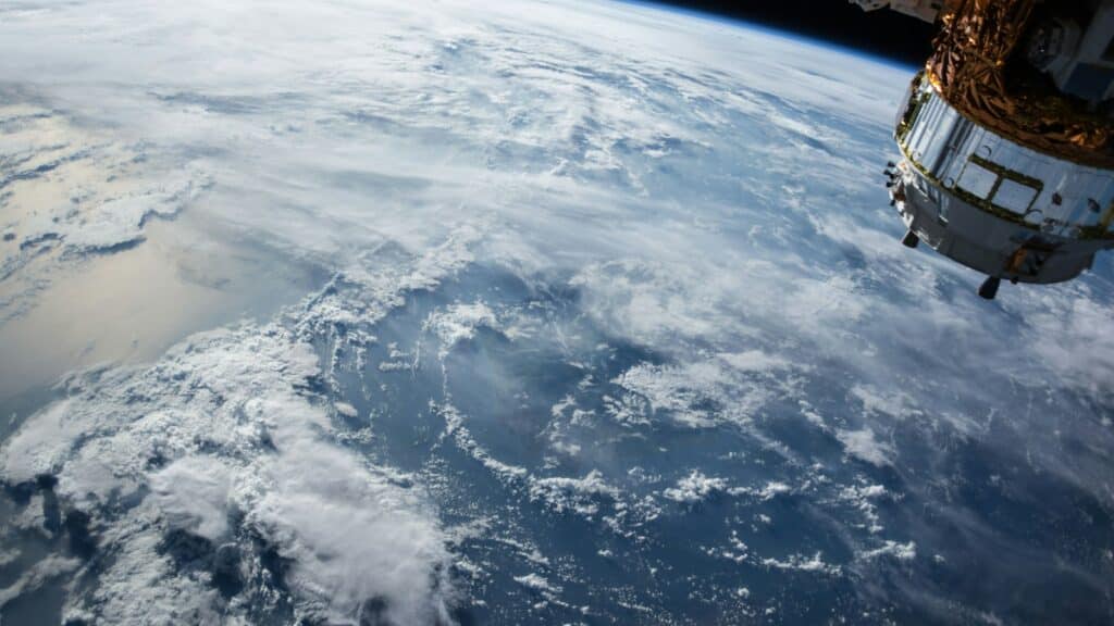 view of Earth and satellite