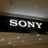 a sony store sign hanging from the ceiling