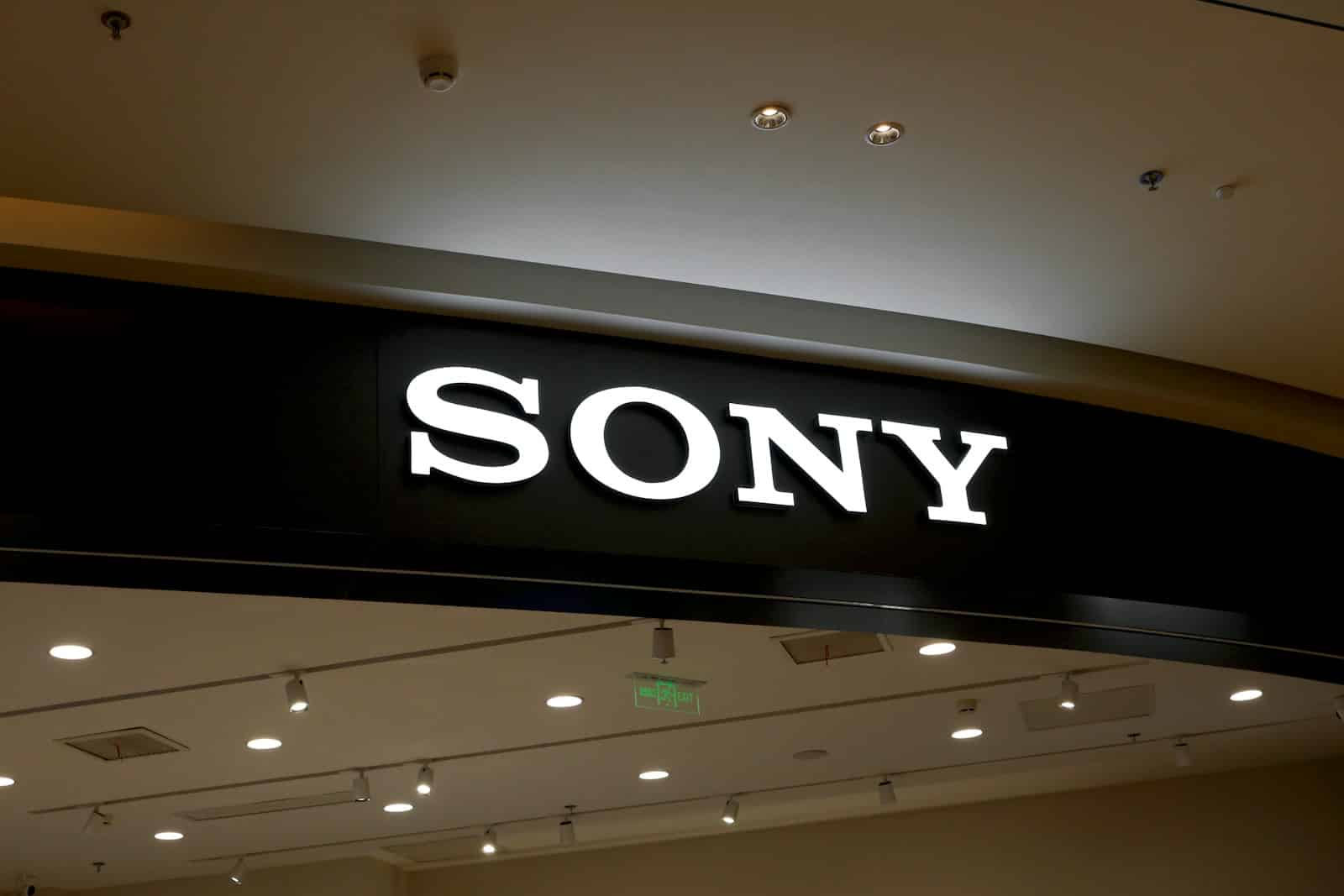 a sony store sign hanging from the ceiling