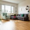 green sofa near glass window