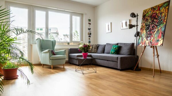 green sofa near glass window