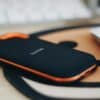 orange and black jbl portable speaker