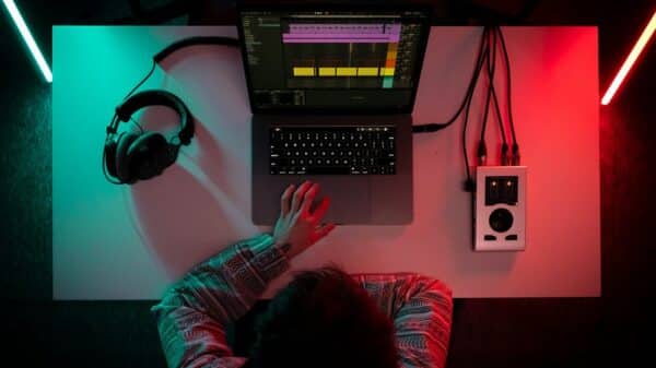 a person sitting in front of a laptop computer