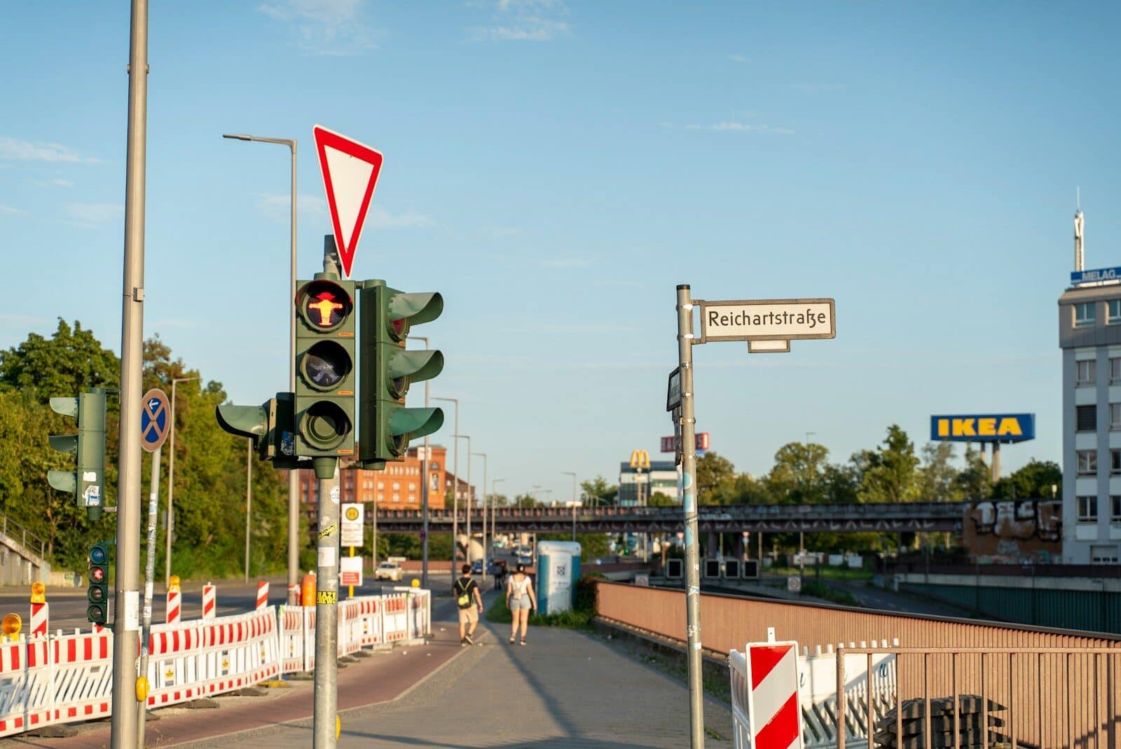 Traffic light on a street with buildings and buildings