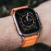 a close up of a person wearing an apple watch