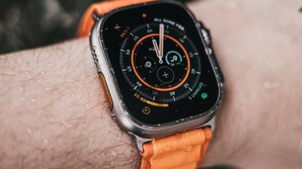 a close up of a person wearing an apple watch
