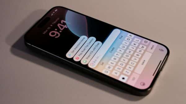 A close up of a cell phone with a keyboard on it