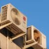 A large air conditioner mounted on the side of a building