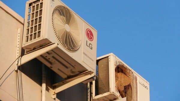 A large air conditioner mounted on the side of a building