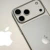 Close-up of a silver iPhone with apple logo.