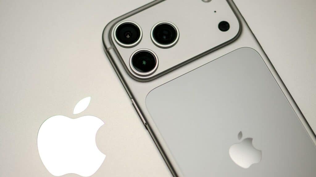 Close-up of a silver iPhone with apple logo.