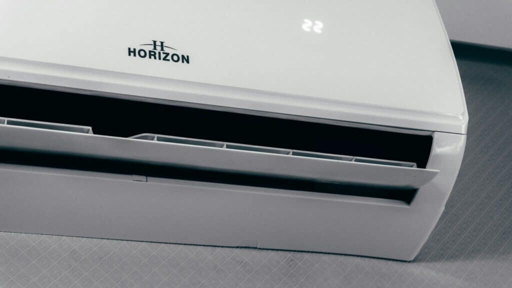 White air conditioner unit displaying 22 degrees
