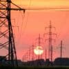 silhouette of electric post during sunset