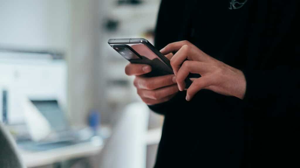 person holding black android smartphone
