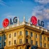 LG logos on a building roof under a blue sky