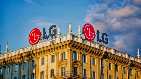 LG logos on a building roof under a blue sky