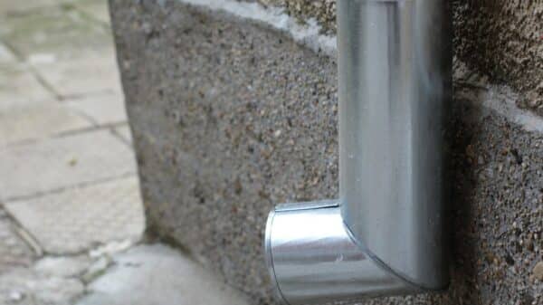 a close up of a metal object on a wall