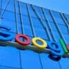 the google logo is displayed on the side of a building