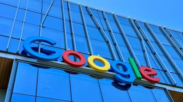 the google logo is displayed on the side of a building