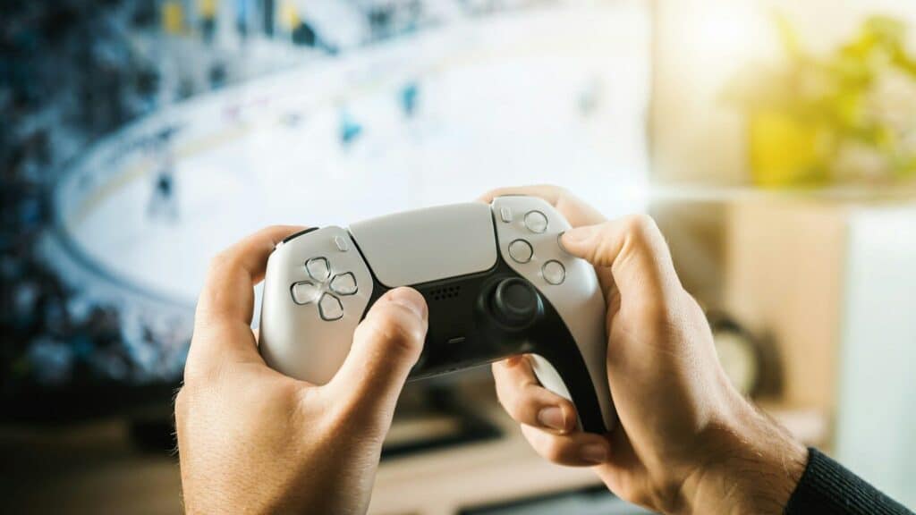 person holding black game controller