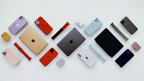 a group of different colored cell phones sitting next to each other