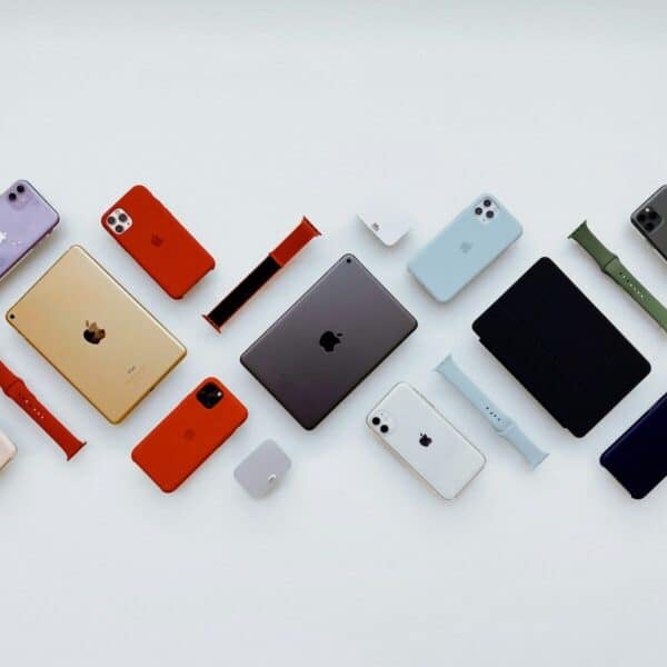 a group of different colored cell phones sitting next to each other