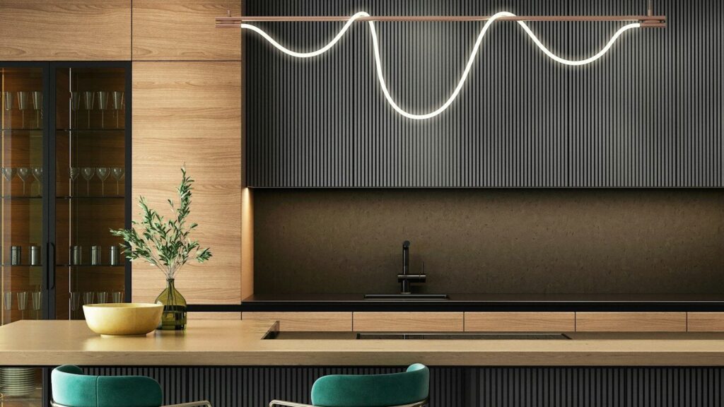 a modern kitchen with a bar and stools